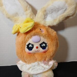 Plush Bunny Doll with Orange Fur and Yellow Bow